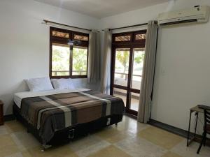 Postel nebo postele na pokoji v ubytování macambira café pousada