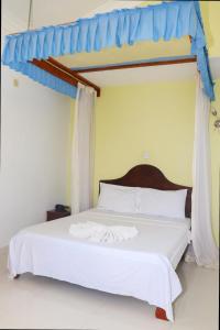 Giường trong phòng chung tại Haveton Hotel and Apartments