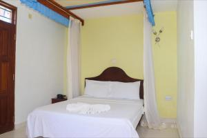 Giường trong phòng chung tại Haveton Hotel and Apartments +26 ảnh