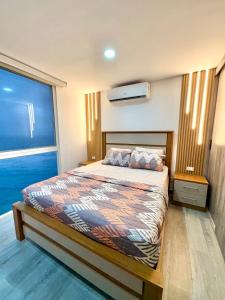 En eller flere senge i et værelse på Sunset City Piso 17 Relájate frente al mar + 30 billeder