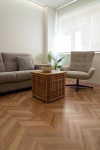 a living room with a couch and a coffee table at Luxury Gran Vía centro Murcia in Murcia