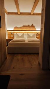 En eller flere senge i et værelse på Il Laricino