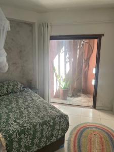 Ένα ή περισσότερα κρεβάτια σε δωμάτιο στο Cozy Suite Olinda
