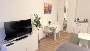 Kuchyň nebo kuchyňský kout v ubytování Modern, quiet apartment right by S-Bahn - close to Munich & airport