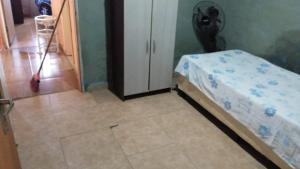 Ένα ή περισσότερα κρεβάτια σε δωμάτιο στο Mar apartamento