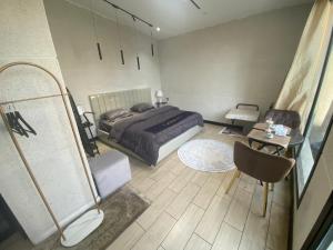 En eller flere senge i et værelse på شاليه كاسا بيرلا - Casa Pearla