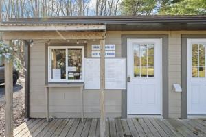 a small building with two windows and a door at Westwood Villas by Coolvacay in Lake Harmony