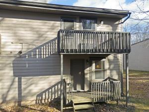 a house with a porch with a wooden deck at Westwood Villas by Coolvacay in Lake Harmony +15 photos