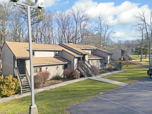 a house with a street light in front of it at Westwood Villas by Coolvacay in Lake Harmony