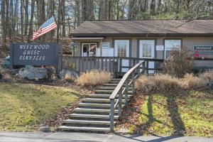 a house with a sign and stairs in front of it at Westwood Villas by Coolvacay in Lake Harmony
