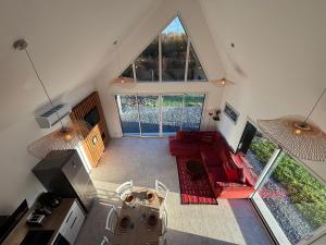 an overhead view of a living room with red furniture at La Croix Perette in Azay-le-Rideau