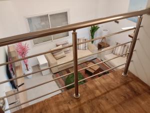 an overhead view of a room with a staircase with a table at Front beach cosy apartment in La Goulette