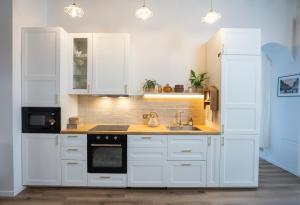 Η κουζίνα ή μικρή κουζίνα στο Normandy Cottage atypical apartment city center