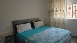 Ένα ή περισσότερα κρεβάτια σε δωμάτιο στο Haut standing Babezouar