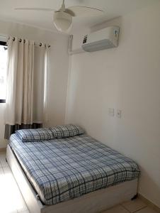 En eller flere senge i et værelse på Hospedagem para grupos