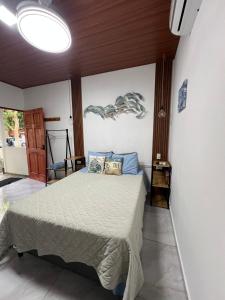 Giường trong phòng chung tại Sunzal Tropical 9