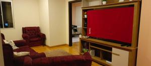 Et tv og/eller underholdning på Escarlet Sweet Home