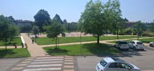 a parking lot with cars parked in a park at Appartamento Padova Chiesanuova in Padova