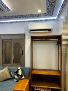 a living room with a blue and white ceiling at Dar Ouadie Serene Blue in Chefchaouen