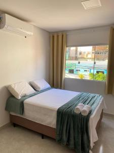 Postel nebo postele na pokoji v ubytování Suítes Central