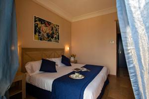 Postel nebo postele na pokoji v ubytování Mahara Hotel & Wellness