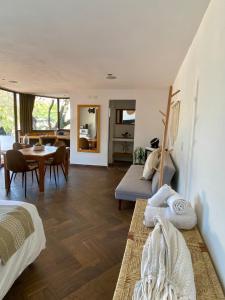 a living room with a bed and a dining room at Mocca Hotels in Tepoztlán +26 photos