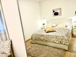 Ένα ή περισσότερα κρεβάτια σε δωμάτιο στο Apartman Stella Maris