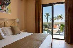 Postel nebo postele na pokoji v ubytování Mahara Hotel & Wellness