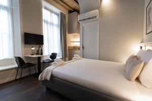 Ένα ή περισσότερα κρεβάτια σε δωμάτιο στο Boutique hotel the Grand