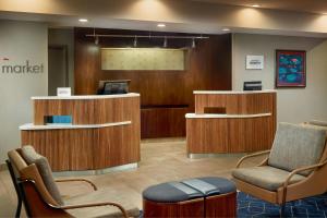 a waiting area with chairs and a waiting room at Courtyard by Marriott Frederick in Frederick