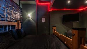 TV a/nebo společenská místnost v ubytování The Hideaway