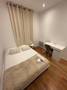 Cama o camas de una habitación en Le Cosy Grange Blanche - 2 chambres