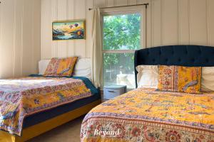 a bedroom with two beds and a window at The Updated Aviator - Minutes to Everything Wichita Falls, TX in Wichita Falls