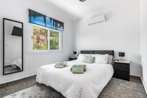 Giường trong phòng chung tại Dúplex El Chaparral Golf +13 ảnh