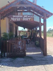 a wooden entrance to a bar with a wooden fence at Maria do Bairro in Guaraciaba do Norte