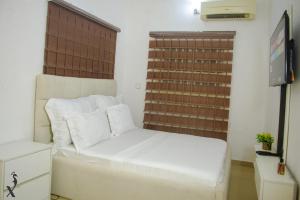 Ένα ή περισσότερα κρεβάτια σε δωμάτιο στο P- Deluxe Luxury Apartment