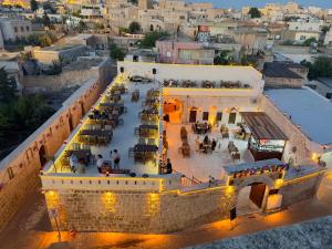 an overhead view of a restaurant in a building at ŞAHMERAN OTEL & Cafe in Midyat