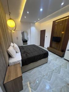 Una cama o camas en una habitación de Elite Suite - 1 Bed