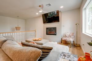 a living room with a couch and a fireplace at 2 Mi to Dtwn Gorgeous Gilbert Gem with Private Yard in Gilbert