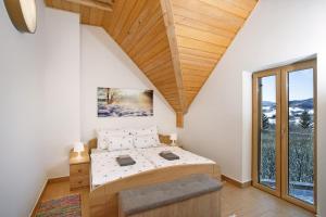 Ένα ή περισσότερα κρεβάτια σε δωμάτιο στο Komforna planinska kuća za odmor