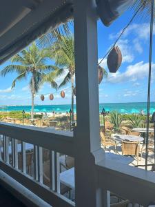 a view of the beach from the balcony of a resort at casaconejo 2 in Leeward