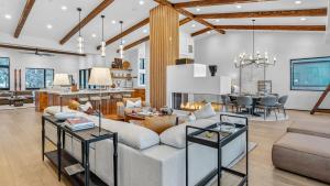 a living room with a couch and a table at Crescendo Crest in Steamboat Springs