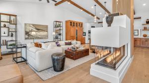 a living room with a couch and a fireplace at Crescendo Crest in Steamboat Springs