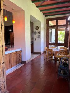 a kitchen with a table and a dining room at Lodge Boutique Casa Cardonal in Paine