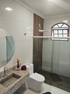 Ένα μπάνιο στο Casa temporada 03 quartos Arraial d'ajuda