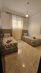 Ένα ή περισσότερα κρεβάτια σε δωμάτιο στο Jad Appartement N1