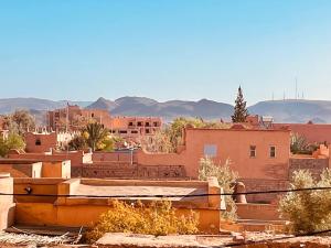 a view of a city with buildings and mountains at Relax Family 04 - Cozy Entire Apartment in City Center in Ouarzazate
