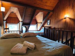 Ένα ή περισσότερα κρεβάτια σε δωμάτιο στο Gite pour 4 personnes en Bretagne