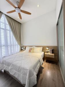 Ένα ή περισσότερα κρεβάτια σε δωμάτιο στο Singgahsini Guesthouse Putrajaya