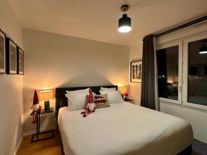 Ένα ή περισσότερα κρεβάτια σε δωμάτιο στο Appt Vue Parc Disneyland-PARIS - Terrasse - Parking Privé